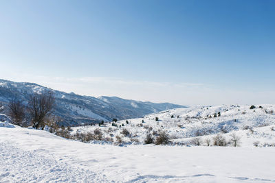 Snow on the mountain peaks on a clear sunny winter day, chimgan, uzbekistan