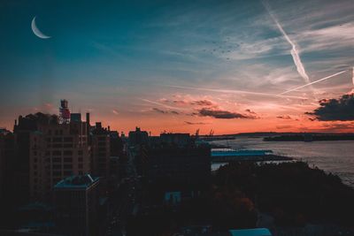 Cityscape against sky during sunset