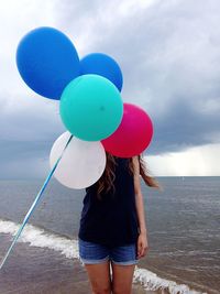 Woman standing on beach