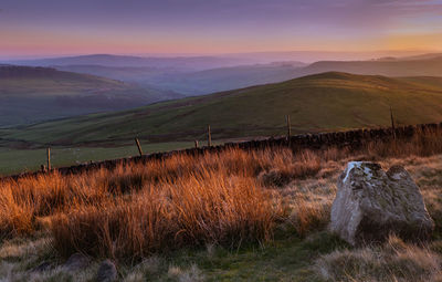 Scenic view of landscape against sky during sunset