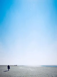 Man on beach against sky