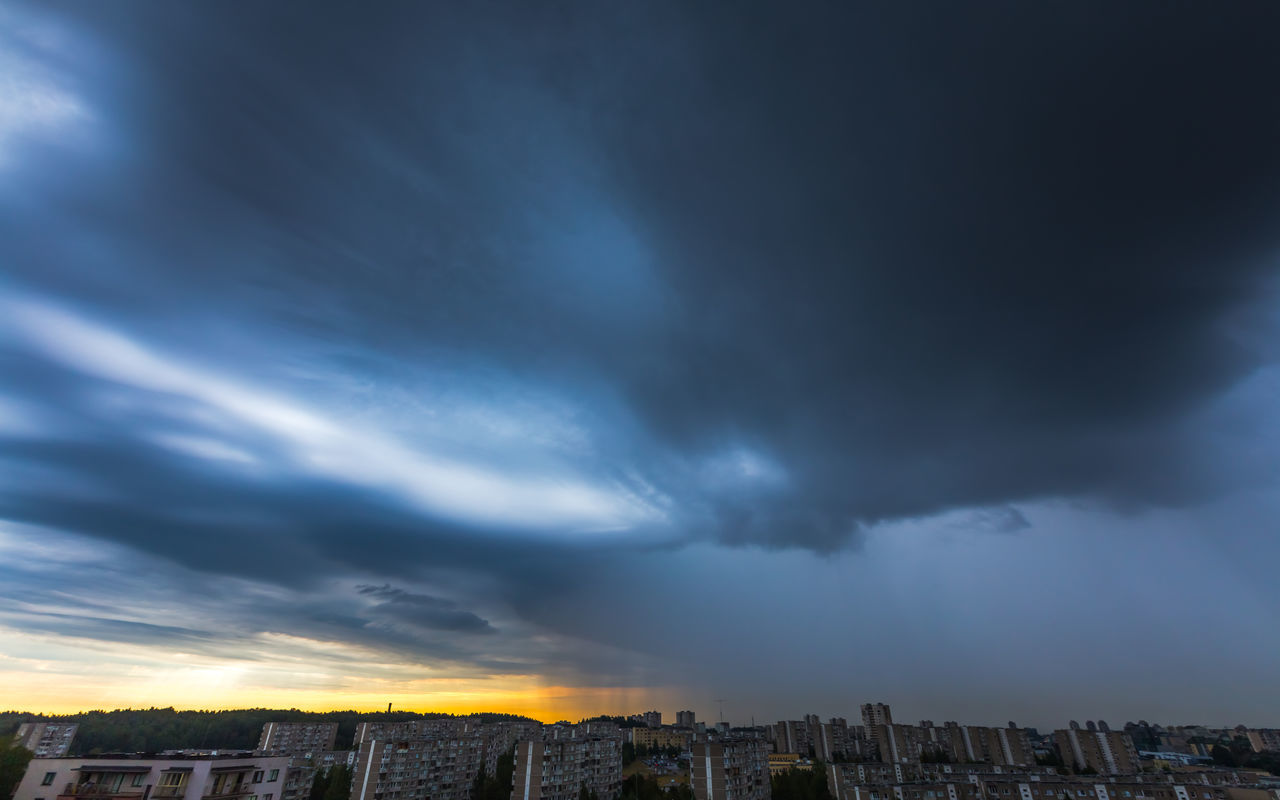 CITY AGAINST DRAMATIC SKY