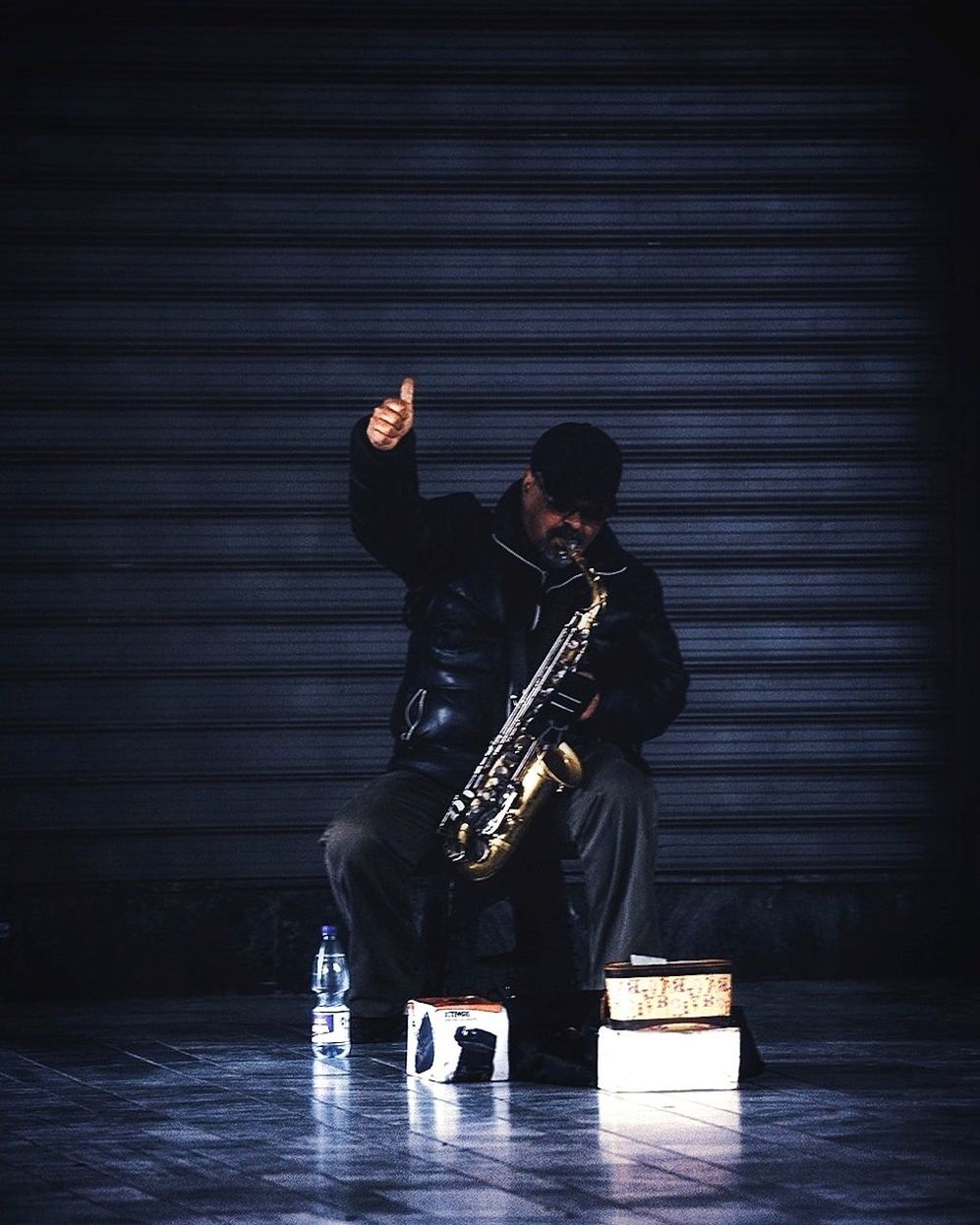 music, musical instrument, arts culture and entertainment, musician, entertainment, black, performance, saxophone, person, one person, adult, men, full length, performing arts, darkness, holding, jazz music, performance art, stage, skill, indoors