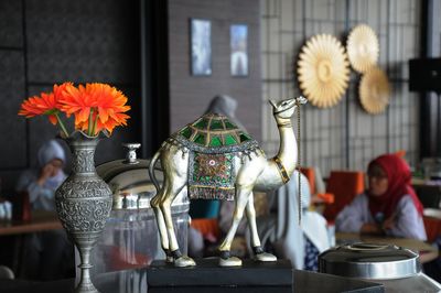 Close-up of flower vase on table