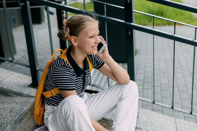 Young woman using mobile phone