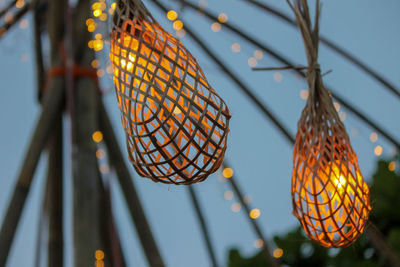 Low angle view of illuminated lanterns hanging on ceiling