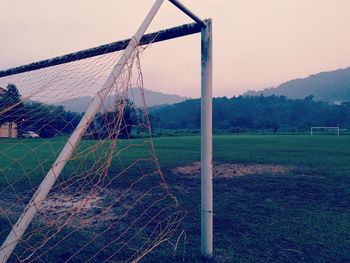 Close-up of swing against sky