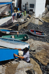 High angle view of fishing boat moored on beach