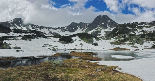 Scenic view of snowcapped mountains against sky