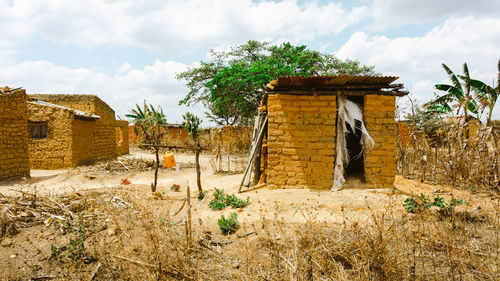 Traditional clay house with farmland in tanzania
