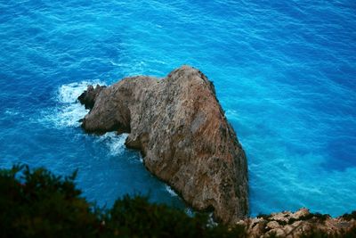 High angle view of rock formation in sea