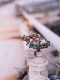 Close-up of toys toy on rusty metal