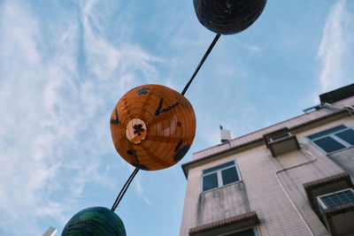 Low angle view of street light against sky