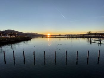 Scenic view of lake against sky during sunset