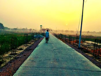 Woman walking on road