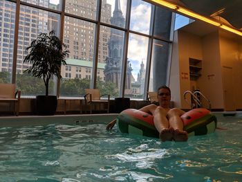 Man relaxing in swimming pool