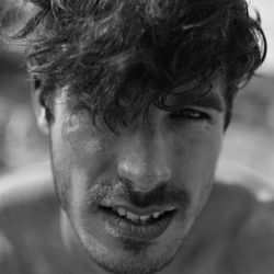 Close-up portrait of smiling young man