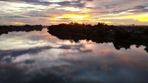 Scenic view of lake against sky during sunset