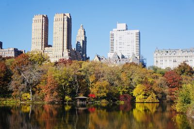 Vibrant shades of orange, red and yellow against the city skyline. 