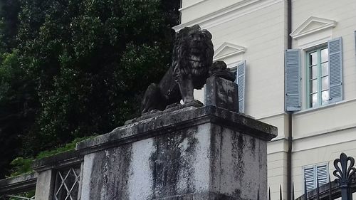 Low angle view of fountain against building