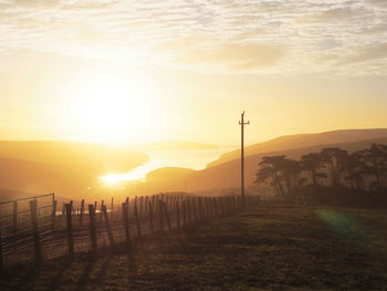 Scenic view of landscape at sunset