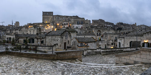 Buildings in city against sky