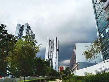 Modern buildings against sky in city