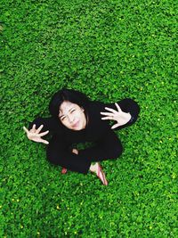 Portrait of smiling young woman on field