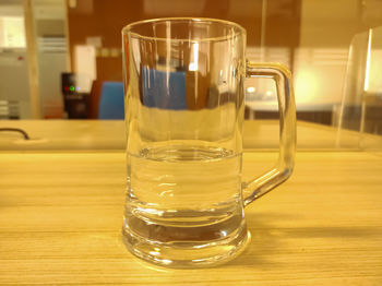 Close-up of beer glass on table
