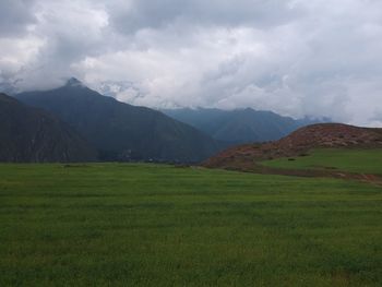 Scenic view of landscape and mountains against sky