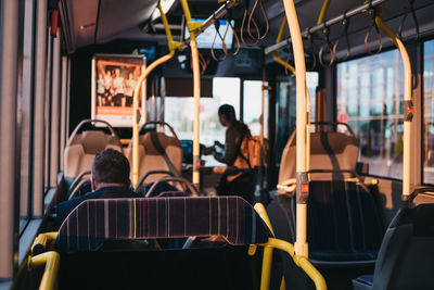 Rear view of people sitting in bus