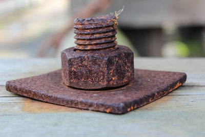 Close-up of rusty metal on table