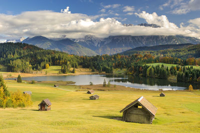 Scenic view of lake and mountains against sky