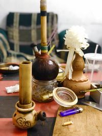 Close-up of wine in glass container on table