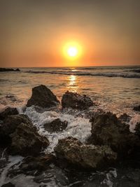 Scenic view of sea against sky during sunset