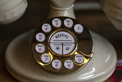 High angle view of retro style landline phone on table