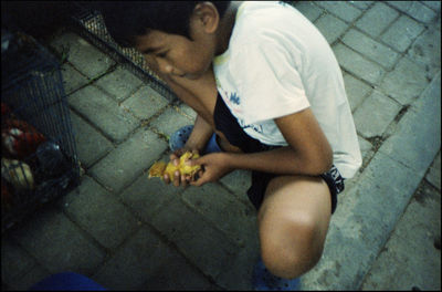 High angle view of woman sitting on floor