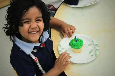 Close-up of hand holding ice cream