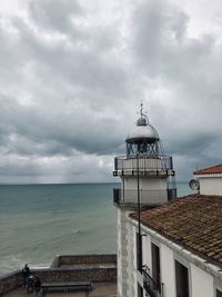 View of sea and buildings against sky