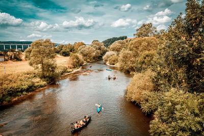 High angle view of people kayaking in river 