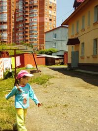 Woman standing on footpath