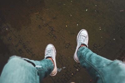 Low section of man standing on floor