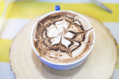 Close-up of cappuccino on table
