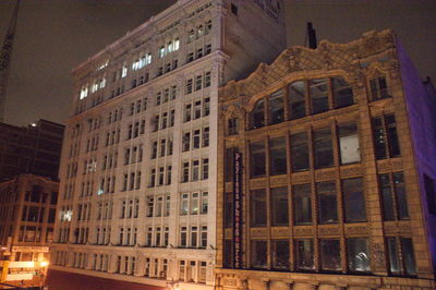 Low angle view of illuminated building at night