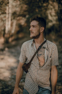 Young man looking away outdoors