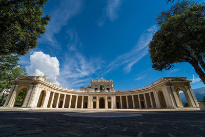Low angle view of historical building against cloudy sky