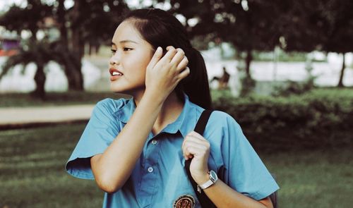 Close-up of young woman standing outdoors