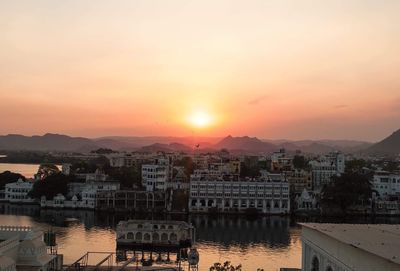 View of cityscape against sky during sunset