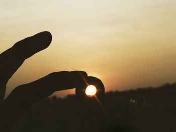 Silhouette of people at sunset
