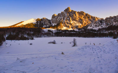 Scenic view of snow covered mountains against sky